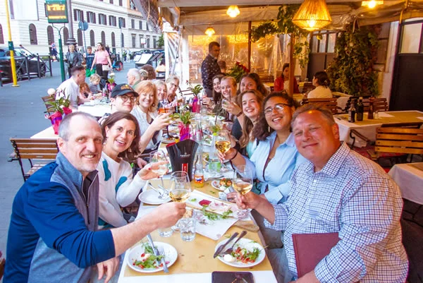 A group of LSC students enjoying a meal while studying abroad